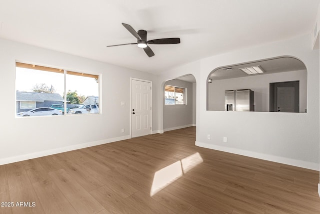 spare room with ceiling fan and wood-type flooring