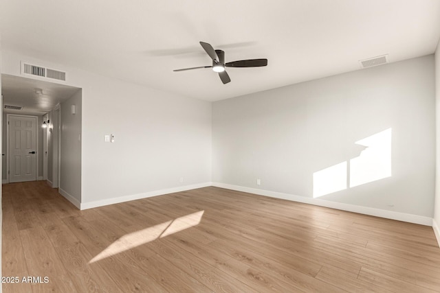 spare room featuring light wood-type flooring and ceiling fan