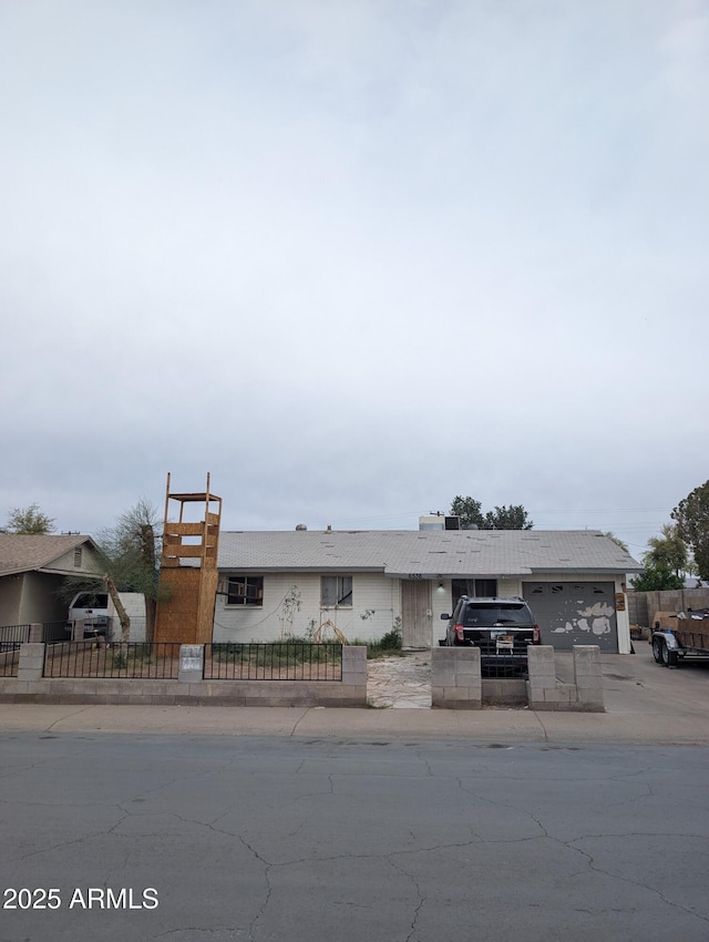 6536 W Mulberry Dr, Phoenix, AZ 85033 - ranch-style house with concrete driveway and a fenced front yard