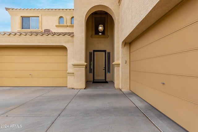 doorway to property featuring a garage