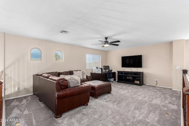 living room with light colored carpet and ceiling fan