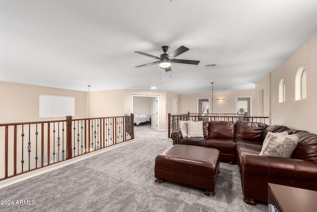 carpeted living room featuring ceiling fan