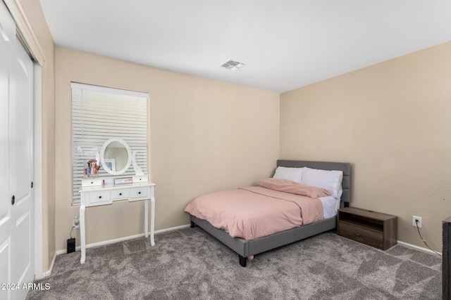 carpeted bedroom featuring a closet