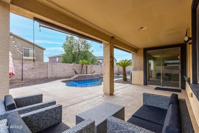 view of patio featuring a pool with hot tub and an outdoor hangout area