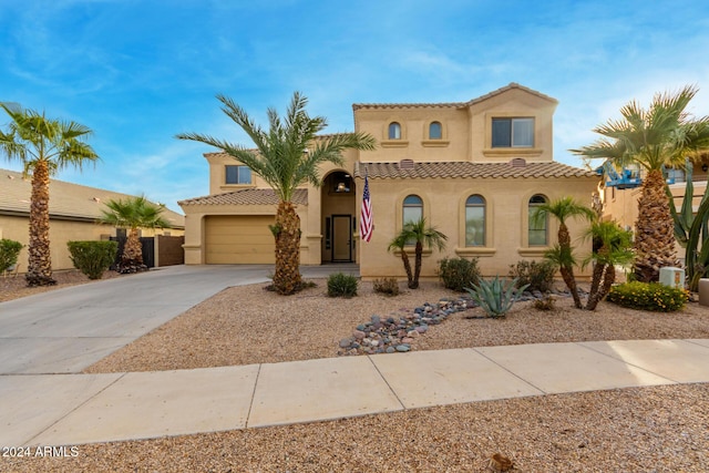 mediterranean / spanish-style home featuring a garage