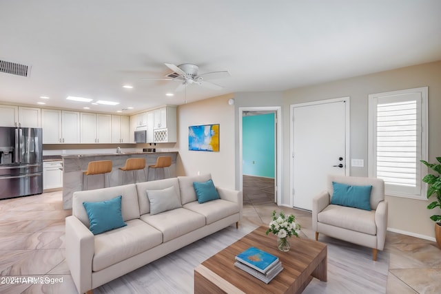 living room featuring ceiling fan