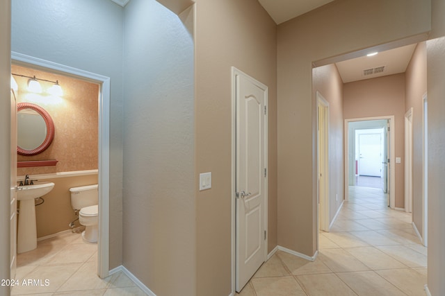 hallway with light tile patterned flooring