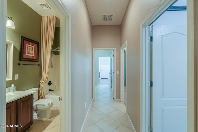 hall with sink and light tile patterned floors