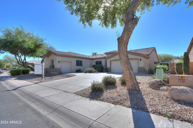 view of front of property with a garage