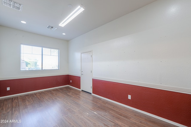 empty room featuring hardwood / wood-style floors