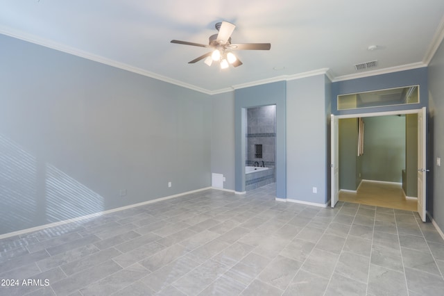 spare room featuring ceiling fan and crown molding