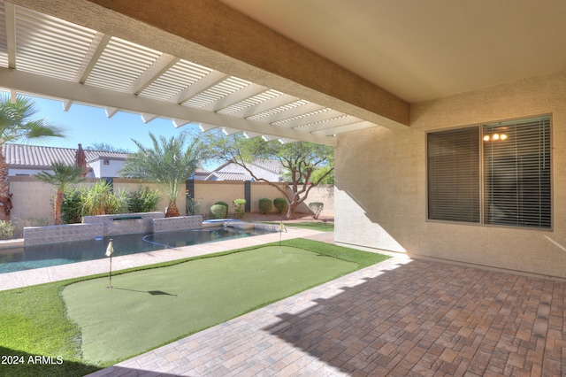 view of patio featuring a swimming pool with hot tub