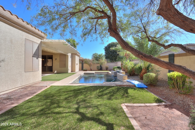 view of pool featuring a hot tub, a patio area, and a yard