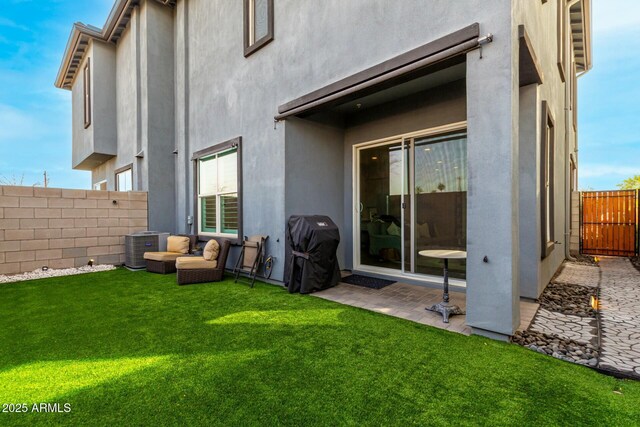 1829 N 43rd Ter, Phoenix, AZ 85008 - back of house featuring a yard, cooling unit, a fenced backyard, and stucco siding
