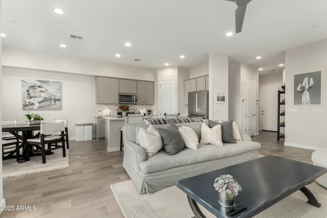 1829 N 43rd Ter, Phoenix, AZ 85008 - living area with recessed lighting, visible vents, and light wood-type flooring