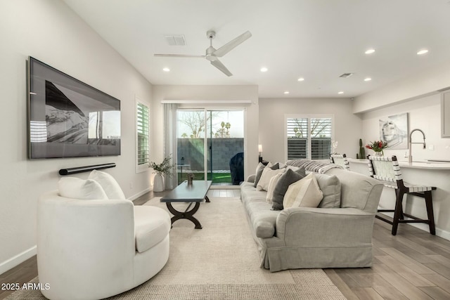 1829 N 43rd Ter, Phoenix, AZ 85008 - living room with baseboards, recessed lighting, ceiling fan, and wood finished floors