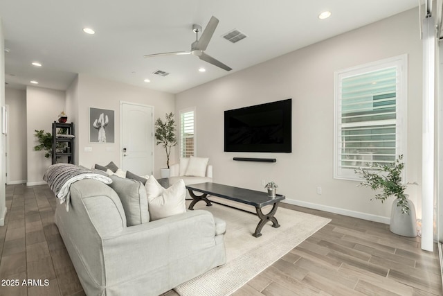 1829 N 43rd Ter, Phoenix, AZ 85008 - living room with ceiling fan, light wood-type flooring, and visible vents
