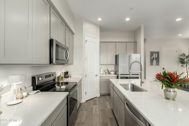 1829 N 43rd Ter, Phoenix, AZ 85008 - kitchen featuring a sink, appliances with stainless steel finishes, gray cabinets, and light countertops