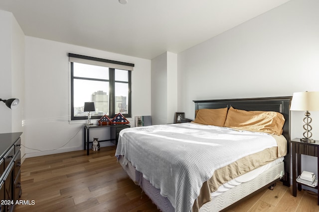 bedroom featuring dark hardwood / wood-style floors