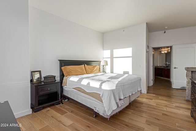 bedroom with light wood-type flooring