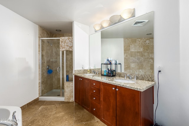 bathroom with vanity and a shower with shower door