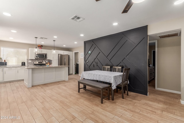 dining space featuring light hardwood / wood-style flooring