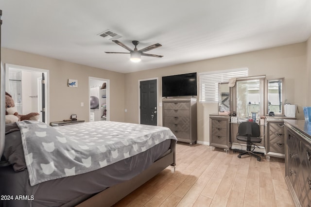 bedroom with a closet, ceiling fan, and light hardwood / wood-style floors