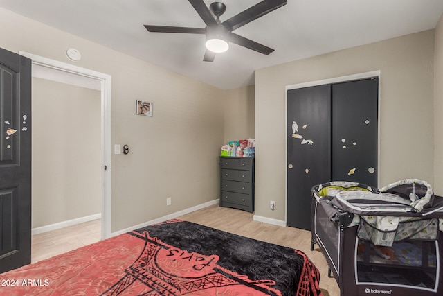 bedroom with light hardwood / wood-style floors and ceiling fan