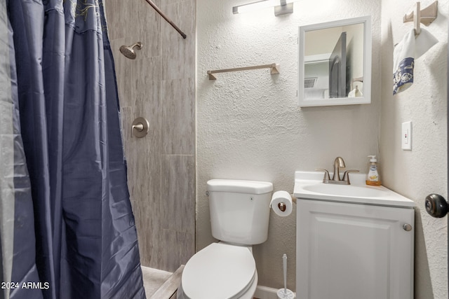 bathroom with vanity, toilet, and a shower with shower curtain