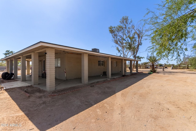 exterior space with a carport