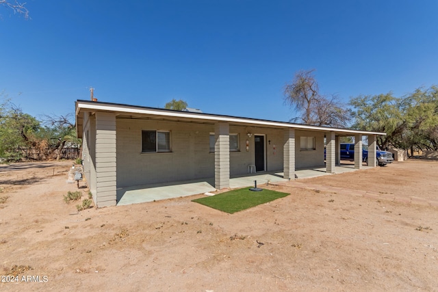 view of front of home with a patio area