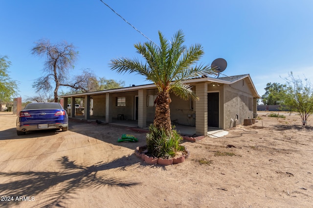 view of front of home featuring a carport