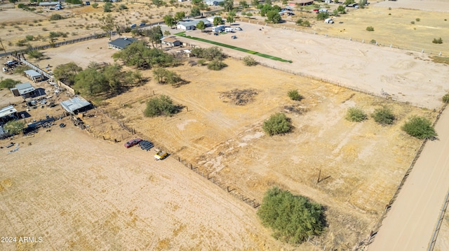 birds eye view of property with a rural view