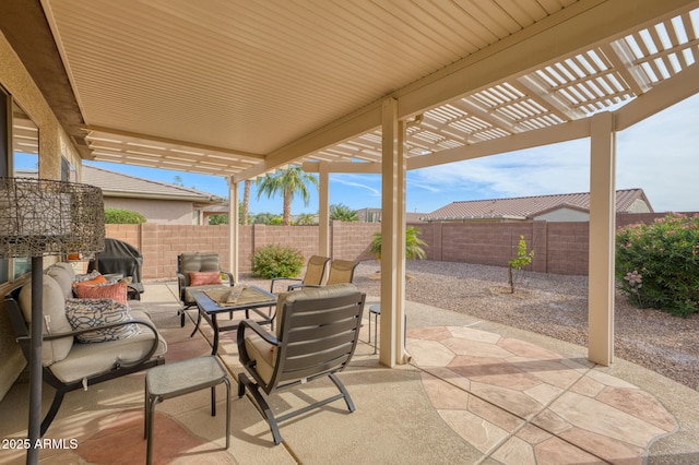 view of patio / terrace featuring area for grilling, an outdoor living space, and a pergola