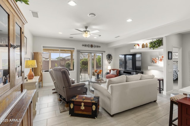 living room featuring ceiling fan