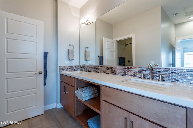 bathroom with decorative backsplash, tile patterned floors, and vanity