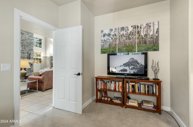 interior space featuring light carpet