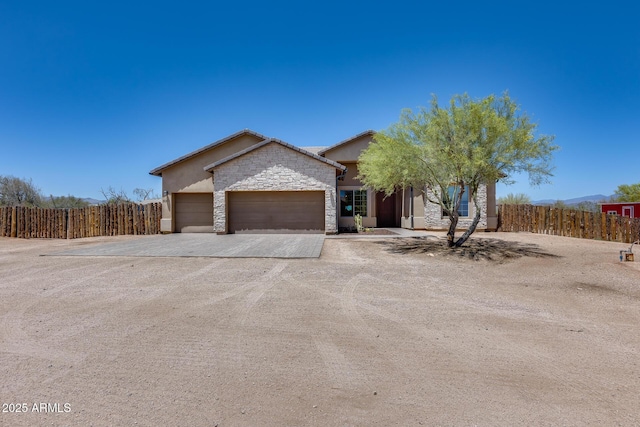 30511 N 162nd Way, Scottsdale, AZ 85262 - ranch-style house featuring driveway, stone siding, an attached garage, and stucco siding