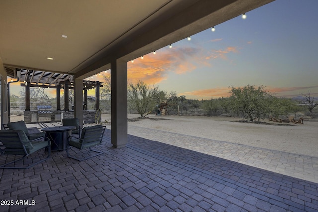30511 N 162nd Way, Scottsdale, AZ 85262 - patio terrace at dusk with an outdoor kitchen and a patio