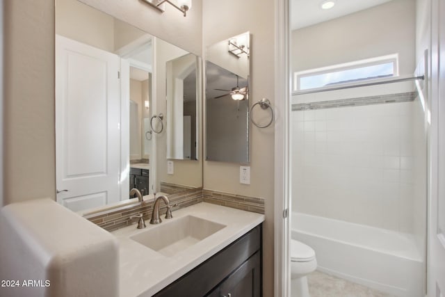 full bathroom featuring tile patterned floors, vanity, ceiling fan, shower / tub combination, and toilet