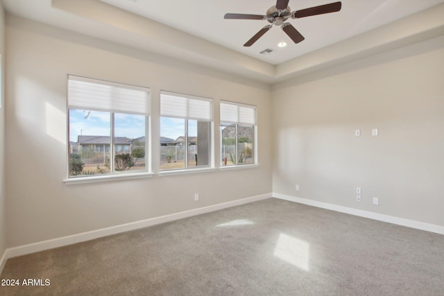 unfurnished room with ceiling fan and carpet floors