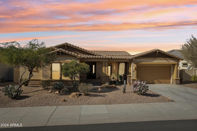 view of front of property with a garage