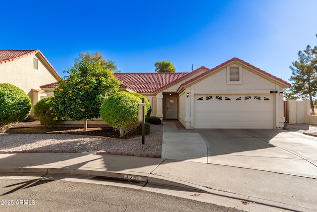 1201 E Campbell Ave, Gilbert, AZ 85234 - view of front facade featuring a tile roof, concrete driveway, a garage, and stucco siding