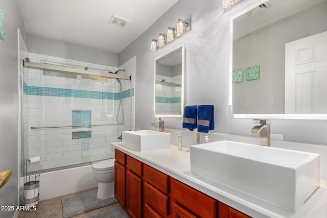 1201 E Campbell Ave, Gilbert, AZ 85234 - bathroom featuring bath / shower combo with glass door and double vanity