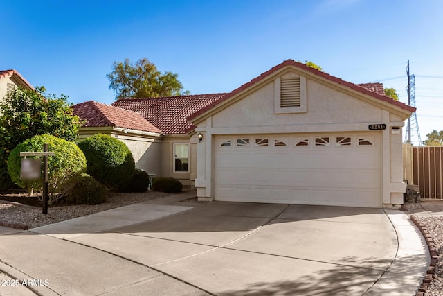 1201 E Campbell Ave, Gilbert, AZ 85234 - view of front of house with driveway, an attached garage, stucco siding, and a tiled roof