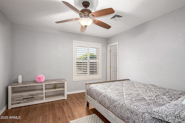 1201 E Campbell Ave, Gilbert, AZ 85234 - bedroom with wood finished floors and a ceiling fan