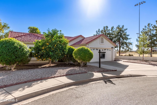 1201 E Campbell Ave, Gilbert, AZ 85234 - view of front of home with concrete driveway, a tile roof, stucco siding, and an attached garage