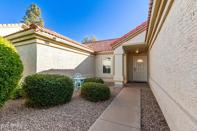 1201 E Campbell Ave, Gilbert, AZ 85234 - view of exterior entry with stucco siding and a tiled roof