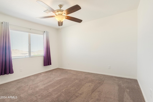 carpeted empty room with ceiling fan