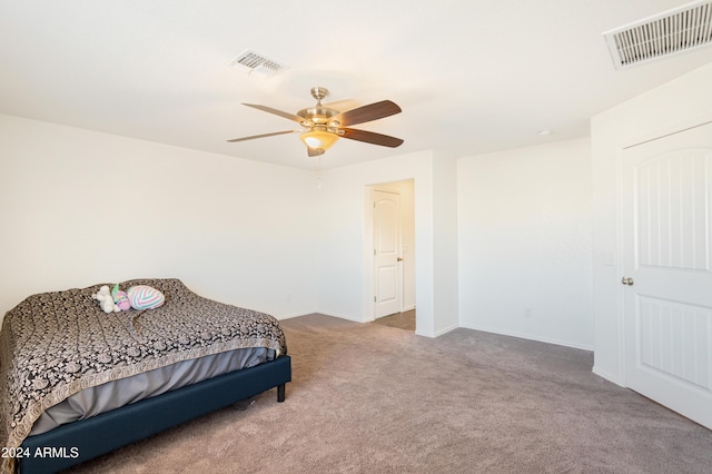 bedroom with ceiling fan and carpet floors